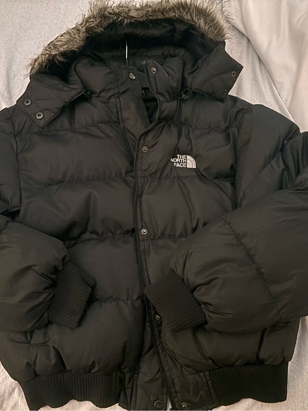 The North Face Black Women’s Hooded Puffer Jacket with Faux Fur Trim